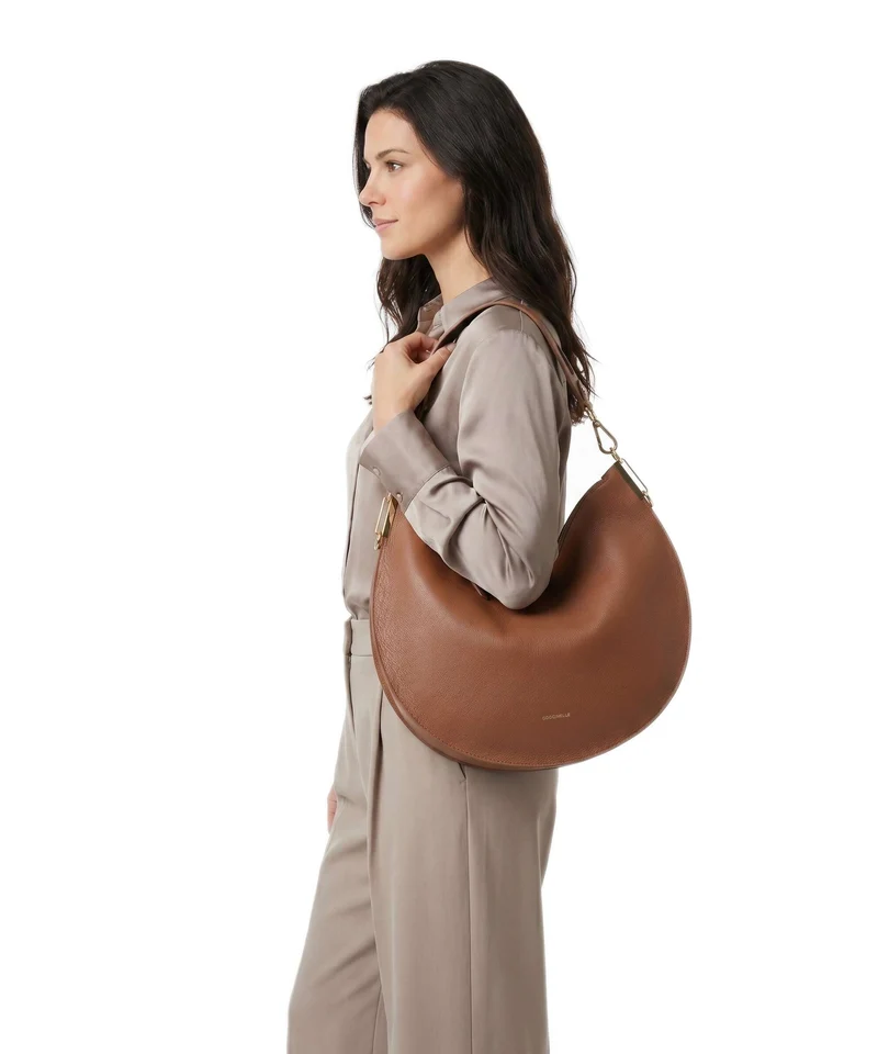 Coccinelle Sunup Beuteltasche cognac/noir