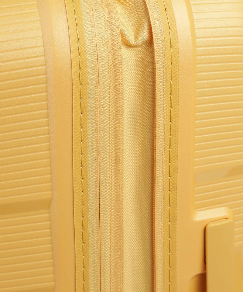 American Tourister Starvibe 4-Rollen Trolley metallic banana