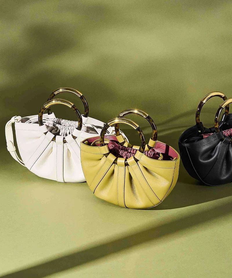 Coccinelle Shell Handtasche pearl