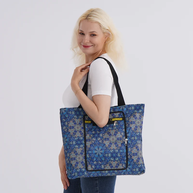 Faltbare Einkaufstasche mit Blumenmuster, aus wasserabweisendem Polyester, mit Innen- und Außentasche, 40x43 cm, Tragegriffe ca. 22 cm, Blau