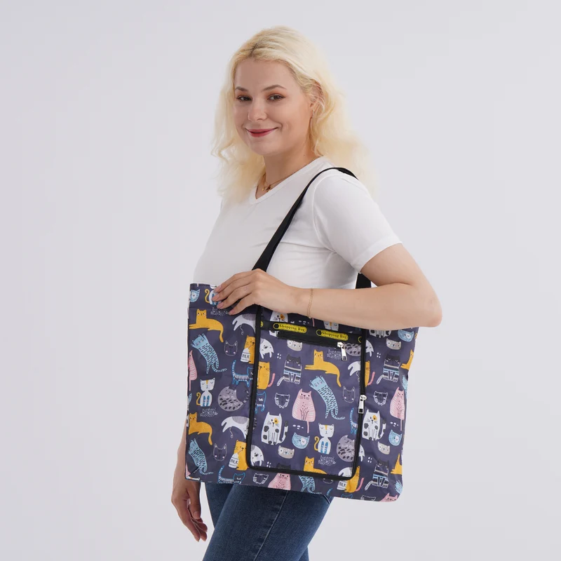 Faltbare Einkaufstasche mit Blumenmuster, aus wasserabweisendem Polyester, mit Innen- und Außentasche, 40x43 cm, Tragegriffe ca. 22 cm, Blau