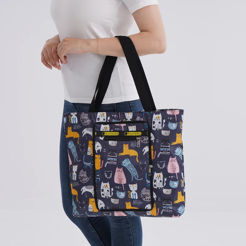 Faltbare Einkaufstasche mit Blumenmuster, aus wasserabweisendem Polyester, mit Innen- und Außentasche, 40x43 cm, Tragegriffe ca. 22 cm, Blau